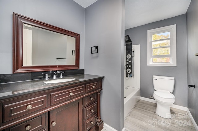 full bathroom featuring toilet, tub / shower combination, vanity, and hardwood / wood-style floors