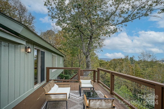 wooden deck with outdoor lounge area