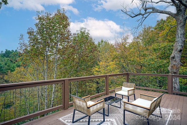 wooden terrace featuring an outdoor hangout area