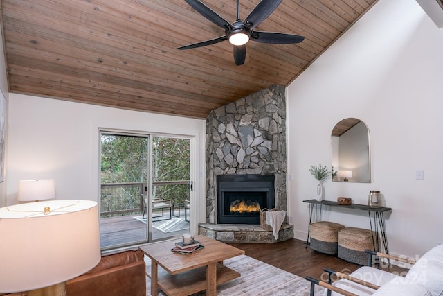 living room featuring high vaulted ceiling, ceiling fan, dark hardwood / wood-style floors, wooden ceiling, and a fireplace