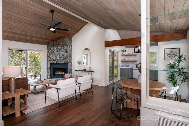 living room featuring ceiling fan, dark wood-type flooring, high vaulted ceiling, wooden ceiling, and a fireplace