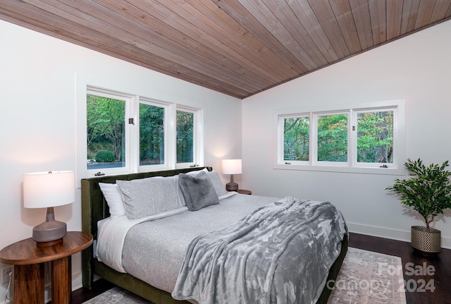 bedroom featuring hardwood / wood-style floors, lofted ceiling, multiple windows, and wooden ceiling