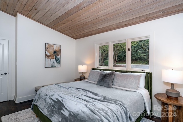 bedroom with lofted ceiling, dark hardwood / wood-style floors, and wooden ceiling