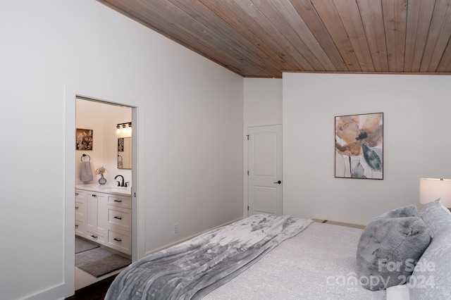 carpeted bedroom featuring sink, vaulted ceiling, wood ceiling, and connected bathroom