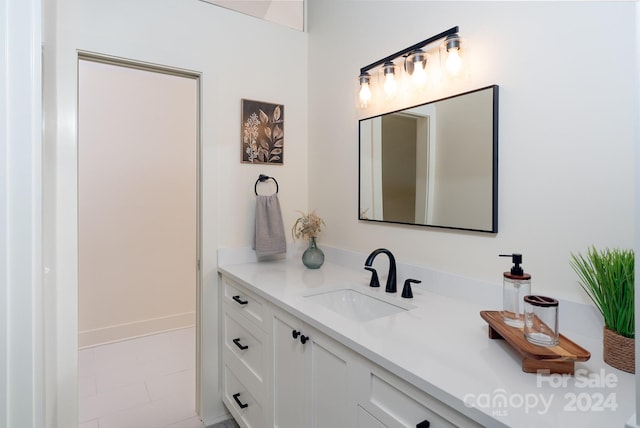 bathroom featuring vanity and tile patterned flooring