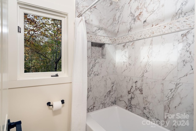 bathroom featuring shower / bath combo