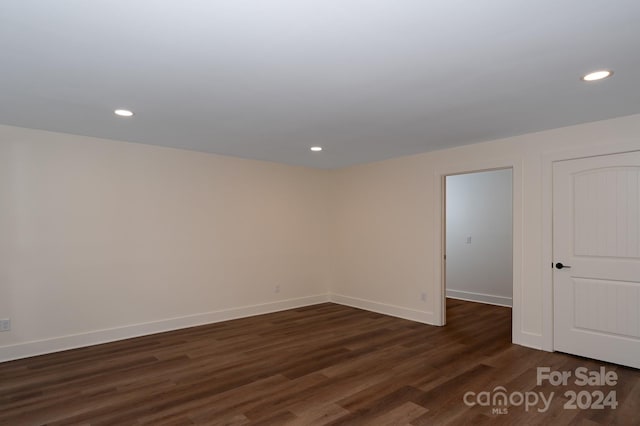 spare room with dark hardwood / wood-style floors