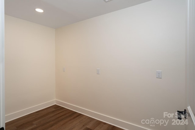 empty room featuring dark hardwood / wood-style flooring