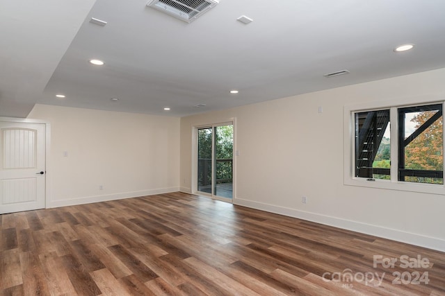 empty room featuring hardwood / wood-style flooring