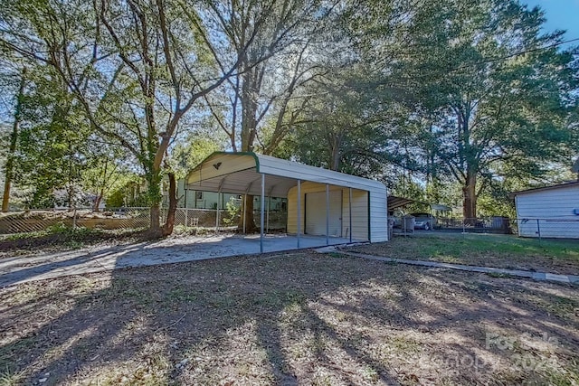 exterior space with a carport