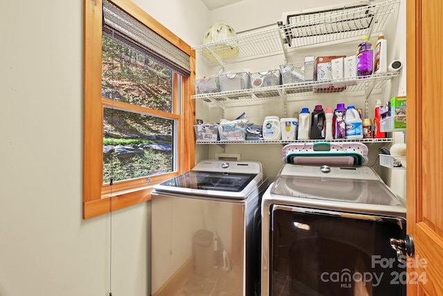 laundry room featuring washer and clothes dryer