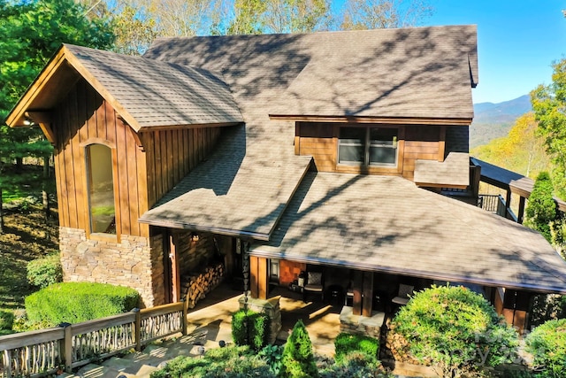 back of property featuring a mountain view