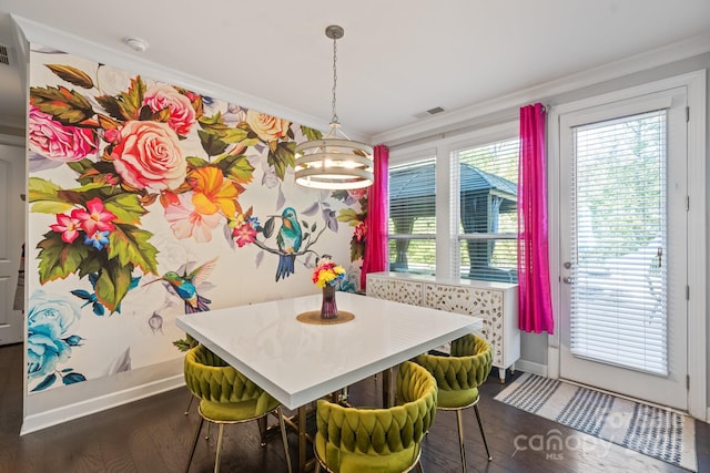 dining area featuring breakfast area, ornamental molding, and dark hardwood / wood-style floors