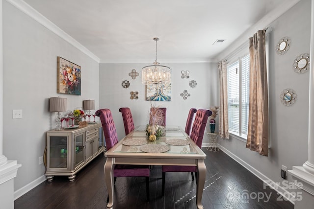 dining area with crown molding, dark hardwood / wood-style flooring, and a chandelier