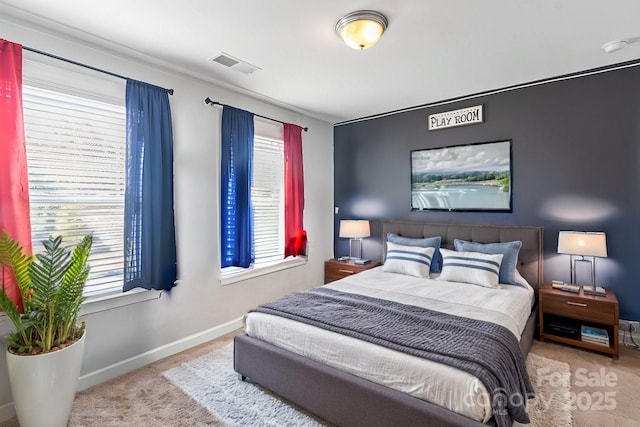 bedroom featuring multiple windows and light carpet