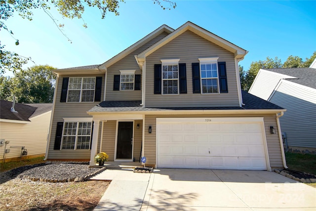 view of front of property featuring a garage