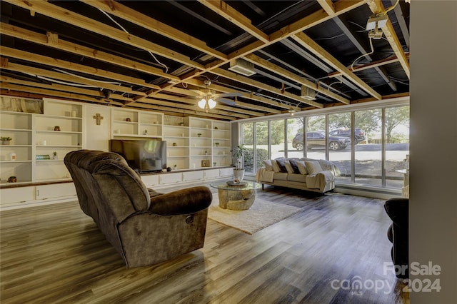 living room featuring hardwood / wood-style floors and ceiling fan