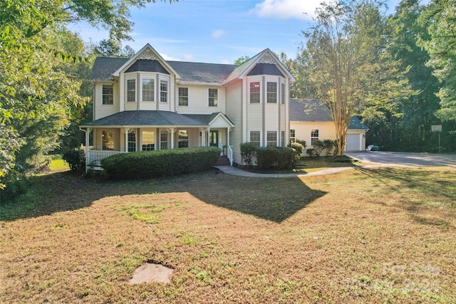 2720 Lentz Rd, China Grove, NC 28023 - victorian home featuring a porch, an outbuilding, and a front yard
