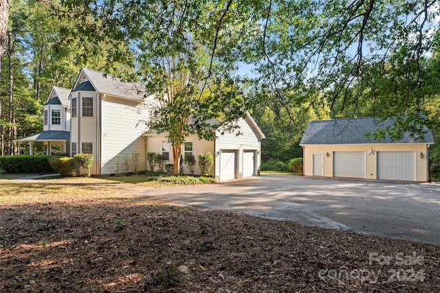 2720 Lentz Rd, China Grove, NC 28023 - exterior space with an outdoor structure and a garage