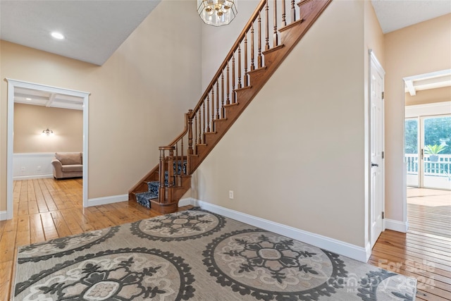 2720 Lentz Rd, China Grove, NC 28023 - foyer with stairway, an inviting chandelier, wood-type flooring, baseboards, and recessed lighting