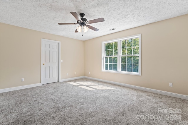 2720 Lentz Rd, China Grove, NC 28023 - carpeted spare room featuring a textured ceiling, baseboards, ceiling fan, and visible vents