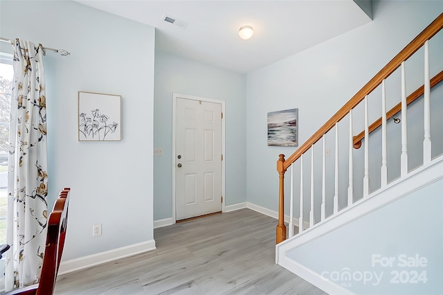 entrance foyer with light wood-type flooring