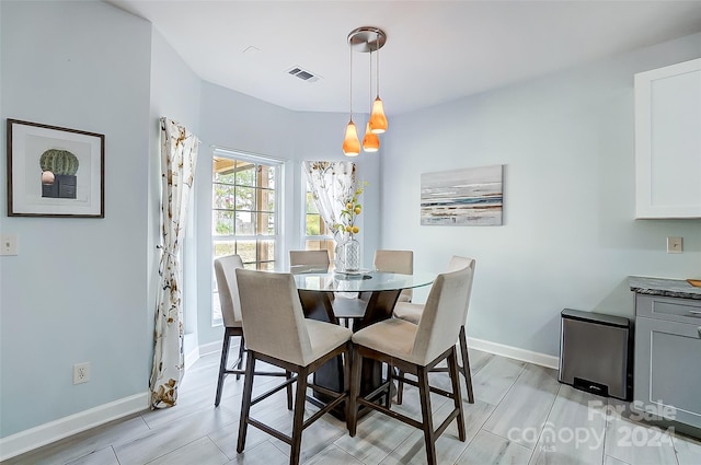 dining space featuring light hardwood / wood-style flooring