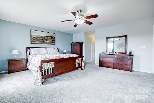 bedroom with light carpet and ceiling fan