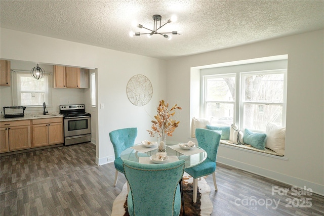 dining room featuring a textured ceiling, baseboards, dark wood-style flooring, and a chandelier