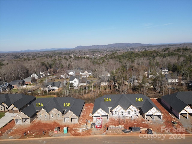 drone / aerial view featuring a mountain view