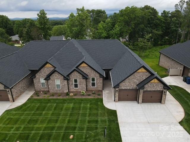 3335 48th Ave NE Unit 13B, Hickory, NC 28601 - craftsman inspired home featuring driveway, an attached garage, a front lawn, and a shingled roof
