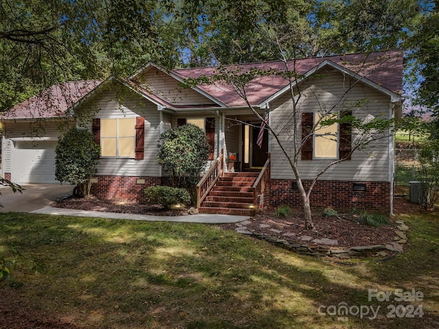 view of front of house with a garage and a front yard