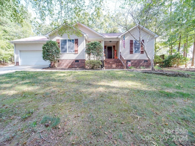 view of front of home featuring a front yard and a garage