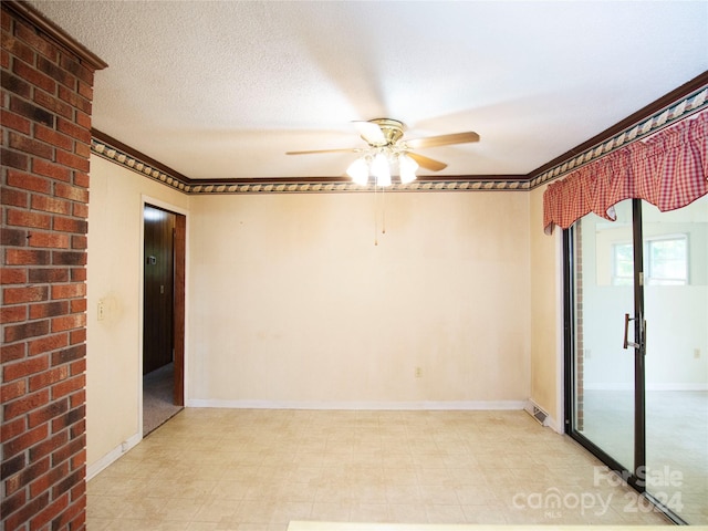 empty room featuring crown molding, a textured ceiling, and ceiling fan