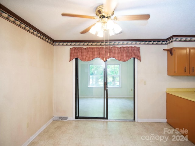 empty room featuring ceiling fan