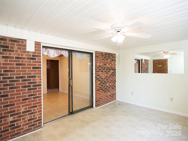 spare room with brick wall