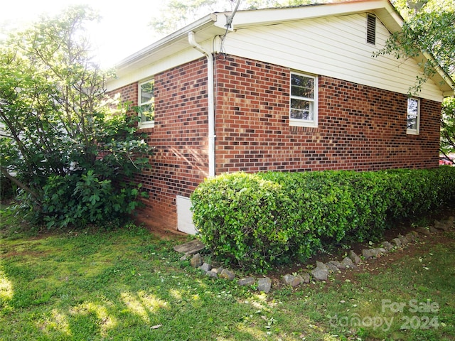 view of home's exterior featuring a yard