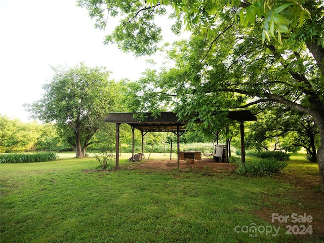 view of property's community with a lawn