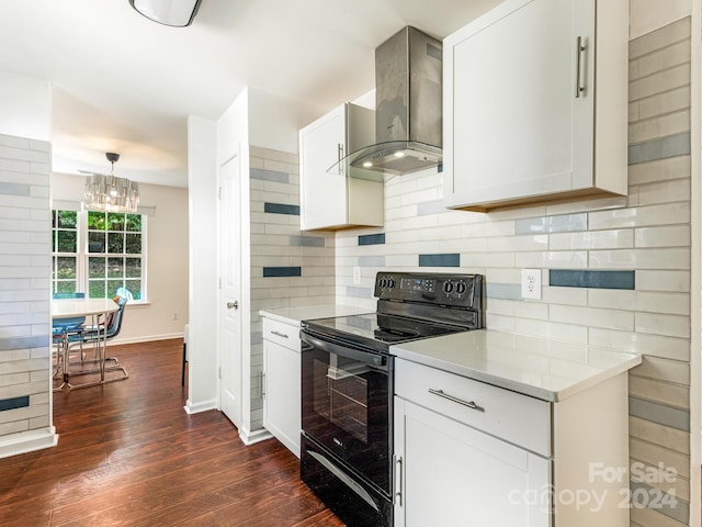 kitchen featuring black range with electric stovetop, wall chimney exhaust hood, white cabinetry, dark hardwood / wood-style flooring, and decorative backsplash