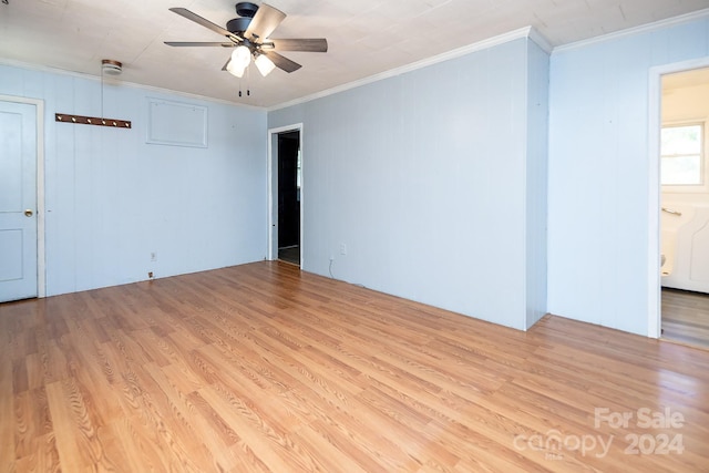 unfurnished room with crown molding, light hardwood / wood-style flooring, and ceiling fan