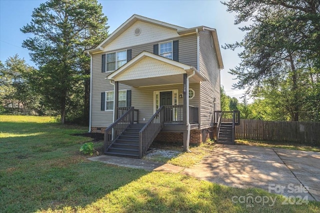 view of front facade with a porch and a front lawn