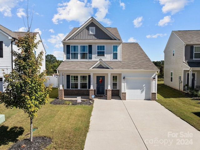 craftsman inspired home with an attached garage, brick siding, board and batten siding, and driveway