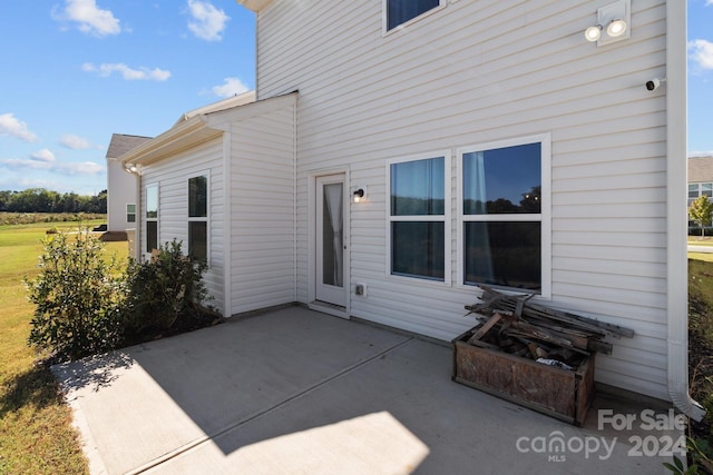 rear view of property featuring a patio