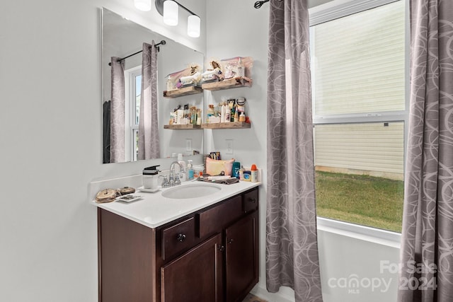 bathroom with vanity and a healthy amount of sunlight