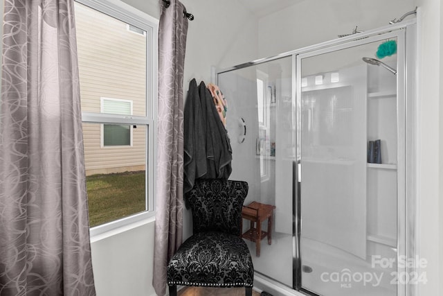 full bath with plenty of natural light and a shower stall