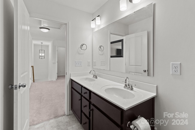 bathroom with a sink and double vanity