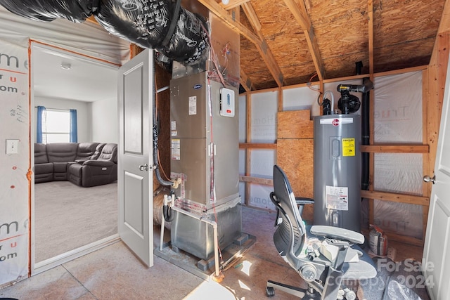 utility room with heating unit and electric water heater