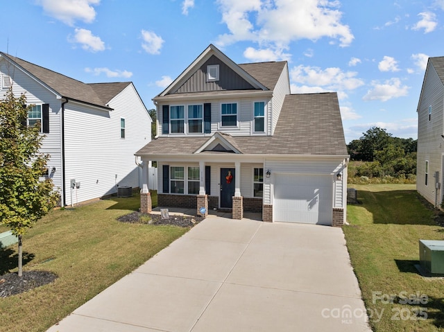 1109 Freeman View Dr, Albemarle, NC 28001 - craftsman inspired home with board and batten siding, an attached garage, covered porch, brick siding, and a front lawn