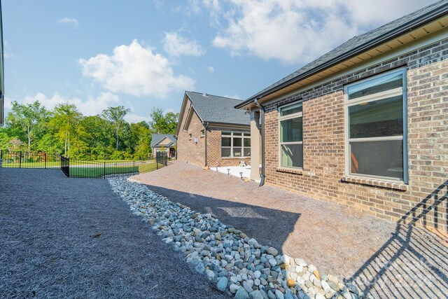 back of property with a patio