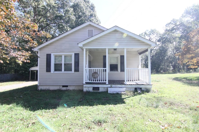 bungalow-style home with a porch and a front lawn